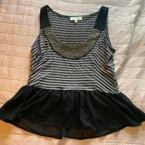 A tank top with a beaded neckline.